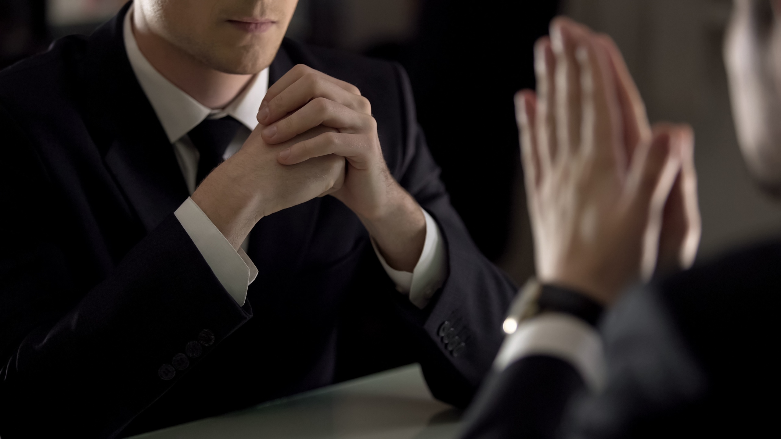 Lawyer listening to private confession of suspect, secret testimony, closeup