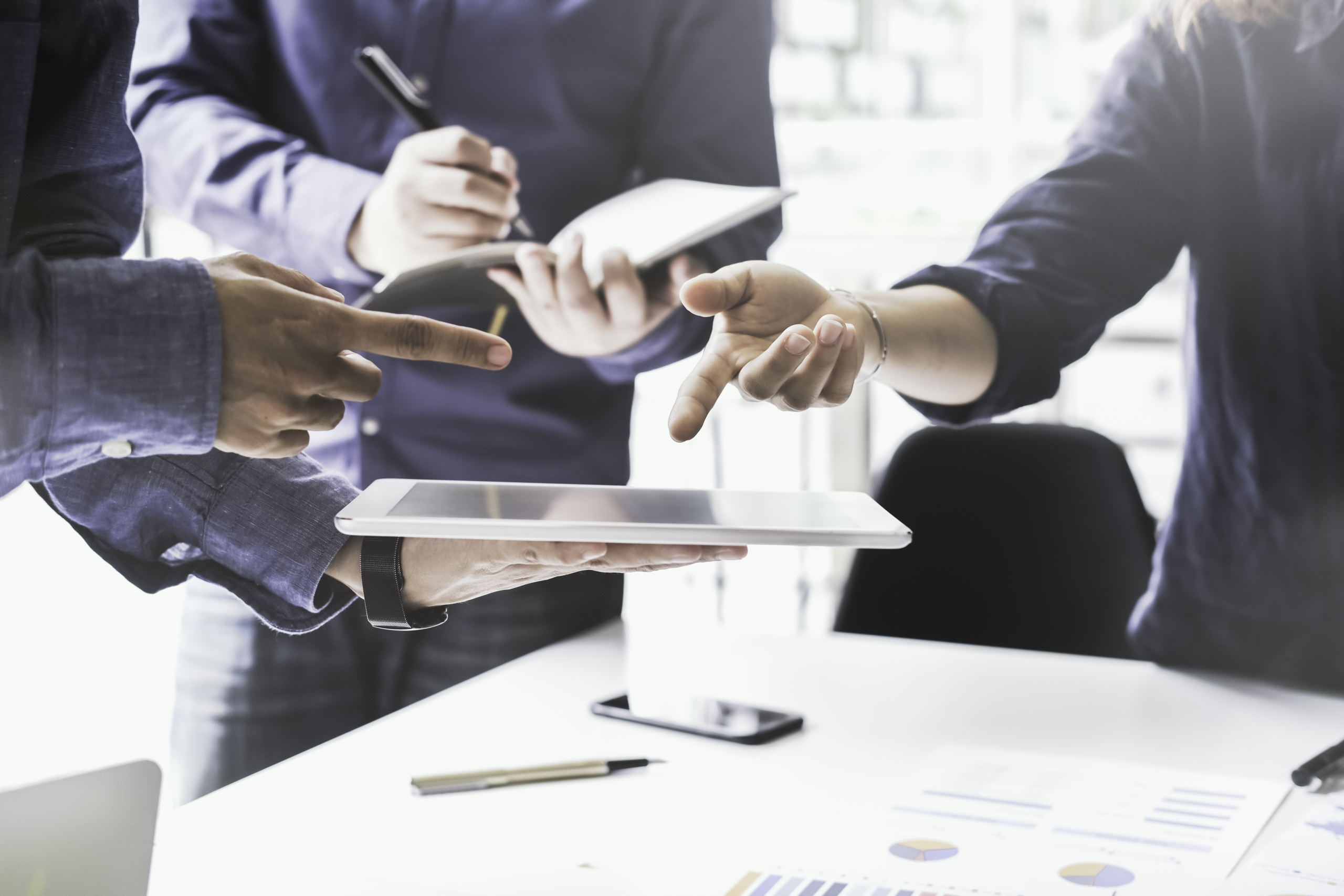 Business adviser meeting to analyze and discuss the situation on the financial report in the meeting room.Investment Consultant,Financial Consultant,Financial advisor and accounting concept